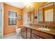 Bathroom boasts granite countertop, twin sinks, modern fixtures, and natural light at 3936 Spyglass Hill Rd, Sarasota, FL 34238