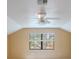 Cozy bedroom featuring a ceiling fan and a window that provides natural light and views at 3936 Spyglass Hill Rd, Sarasota, FL 34238
