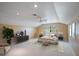 Bright bedroom boasts neutral colors, soft lighting and a ceiling fan, creating a relaxing and inviting retreat at 3936 Spyglass Hill Rd, Sarasota, FL 34238
