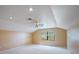 Bright and airy bedroom with carpeted floors, neutral walls, and a ceiling fan for added comfort and style at 3936 Spyglass Hill Rd, Sarasota, FL 34238