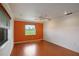 Bedroom featuring hardwood floors, one window with blinds, and a calming color scheme at 3936 Spyglass Hill Rd, Sarasota, FL 34238