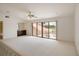 Spacious bonus room with wet bar and a sliding door to a large deck overlooking the golf course at 3936 Spyglass Hill Rd, Sarasota, FL 34238