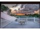 Outdoor deck showcasing stunning sunset views of the golf course, creating a peaceful ambiance at 3936 Spyglass Hill Rd, Sarasota, FL 34238