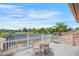 Outdoor deck featuring a bistro set with serene views of the golf course and pool at 3936 Spyglass Hill Rd, Sarasota, FL 34238