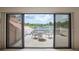 Covered deck features a seating area and a picturesque view of the community's manicured greens and blue skies at 3936 Spyglass Hill Rd, Sarasota, FL 34238