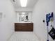 Hallway with built-in cabinets and a pass-through window to the kitchen area at 3936 Spyglass Hill Rd, Sarasota, FL 34238
