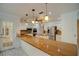 Spacious kitchen with granite countertops, white cabinets, and stainless steel appliances at 3936 Spyglass Hill Rd, Sarasota, FL 34238
