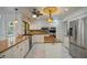 Bright kitchen featuring granite countertops, stainless steel appliances, and white cabinetry at 3936 Spyglass Hill Rd, Sarasota, FL 34238