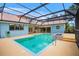 The screened-in pool boasts a lovely patio and backyard, creating a perfect oasis for relaxation and entertaining at 3936 Spyglass Hill Rd, Sarasota, FL 34238