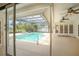 A beautiful screened-in pool with an adjacent patio area, offering an inviting outdoor living space at 3936 Spyglass Hill Rd, Sarasota, FL 34238