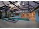 Beautiful screened pool with a fire feature, surrounded by a spacious deck and landscaping at 3936 Spyglass Hill Rd, Sarasota, FL 34238