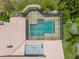Aerial view of a screened-in pool, with lounge area, providing a private oasis for relaxation and recreation at 3936 Spyglass Hill Rd, Sarasota, FL 34238