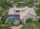 A spacious backyard with a screened-in pool, balcony and ample space for outdoor living at 3936 Spyglass Hill Rd, Sarasota, FL 34238