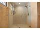 Glass-enclosed shower stall features sleek fixtures and a rain-style showerhead for a luxurious experience at 3936 Spyglass Hill Rd, Sarasota, FL 34238