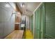 A functional utility room with shelving, storage cabinets, and a durable yellow floor at 3936 Spyglass Hill Rd, Sarasota, FL 34238
