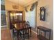 Elegant dining room showcasing the dark wood dining set, china cabinet and patterned rug at 40 Mariner Ln, Rotonda West, FL 33947