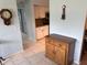 Hallway view of the kitchen, showing tile flooring and decorative wall accents at 40 Mariner Ln, Rotonda West, FL 33947