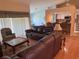Spacious living room overlooking the kitchen with bar seating and sliding glass door at 40 Mariner Ln, Rotonda West, FL 33947