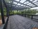 Enjoy outdoor living on this wooden deck overlooking a serene lake and lush greenery at 4210 Baird St, Sarasota, FL 34232
