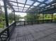 Waterfront deck featuring a pergola overlooking a tranquil river, providing a serene outdoor space at 4210 Baird St, Sarasota, FL 34232