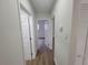 Hallway features wood-look flooring and neutral paint at 4210 Baird St, Sarasota, FL 34232