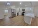 Modern kitchen features stainless steel appliances, white cabinets, and ample counter space with an island at 4210 Baird St, Sarasota, FL 34232