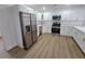 Modern kitchen features stainless steel appliances, white cabinets, and ample counter space with an island at 4210 Baird St, Sarasota, FL 34232