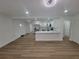 Bright, open-concept living space with recessed lighting, wood floors, and a seamless flow to kitchen at 4210 Baird St, Sarasota, FL 34232