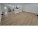 Bright, open-concept living space with recessed lighting, wood floors, and a seamless flow to kitchen at 4210 Baird St, Sarasota, FL 34232