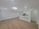 Bright, open-concept living space with recessed lighting, wood floors, and a seamless flow to kitchen at 4210 Baird St, Sarasota, FL 34232