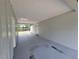 Covered outdoor patio space offering access to the backyard and a private entrance at 4210 Baird St, Sarasota, FL 34232