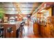 Entertainment space with a bar, granite countertops, stools, and rustic decor at 4225 Ulman Ave, North Port, FL 34286
