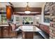 Charming breakfast nook features a granite table, cushioned benches, and a bright, sunny window view at 4225 Ulman Ave, North Port, FL 34286