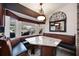 Inviting breakfast nook with granite table, built-in seating, and a view of the outdoor water feature at 4225 Ulman Ave, North Port, FL 34286