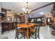 Open-concept dining area with wood table, adjacent to the kitchen and living room at 4225 Ulman Ave, North Port, FL 34286