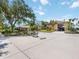 Exterior shot of the home and an oversized concrete driveway with a basketball hoop at 4225 Ulman Ave, North Port, FL 34286