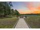 Scenic fire pit area near the lake, perfect for outdoor gatherings at 4225 Ulman Ave, North Port, FL 34286
