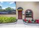 Charming front entrance with an awning and manicured landscaping at 4225 Ulman Ave, North Port, FL 34286