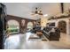 Spacious living room featuring tile floors, a ceiling fan, and stylish decor with window views at 4225 Ulman Ave, North Port, FL 34286