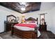 Elegant main bedroom with decorative ceiling, wooden furnishings, and natural light at 4225 Ulman Ave, North Port, FL 34286