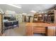 Large office space featuring custom built-ins, carpet flooring, and ample work areas at 4225 Ulman Ave, North Port, FL 34286