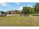 Sprawling property with a detached garage, fire pit, and ample outdoor space at 4225 Ulman Ave, North Port, FL 34286
