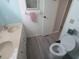 Bathroom featuring vanity, a toilet and ample counter space at 5119 Glen Echo Ave, Sarasota, FL 34234