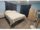Bedroom with a queen bed, laminate floors, and a closet at 5119 Glen Echo Ave, Sarasota, FL 34234