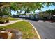 Charming community clubhouse with lush landscaping, a well-maintained asphalt driveway, and lovely entry at 5119 Glen Echo Ave, Sarasota, FL 34234