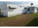 Mobile home exterior showcases tidy landscaping and functional design, ideal for comfortable and convenient living at 5119 Glen Echo Ave, Sarasota, FL 34234