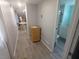 Hallway featuring wood-look floors and access to the bathroom at 5119 Glen Echo Ave, Sarasota, FL 34234