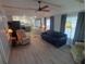 Inviting living room features cozy furniture, neutral walls, and an open flow into the kitchen area at 5119 Glen Echo Ave, Sarasota, FL 34234