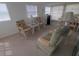 Bright and airy living room with comfortable seating and ample natural light creates a relaxing atmosphere at 5119 Glen Echo Ave, Sarasota, FL 34234