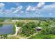 A beautiful aerial view of Robinson Preserve featuring lush trees, water, boardwalks and a playground at 523 Wildlife Gln, Bradenton, FL 34209